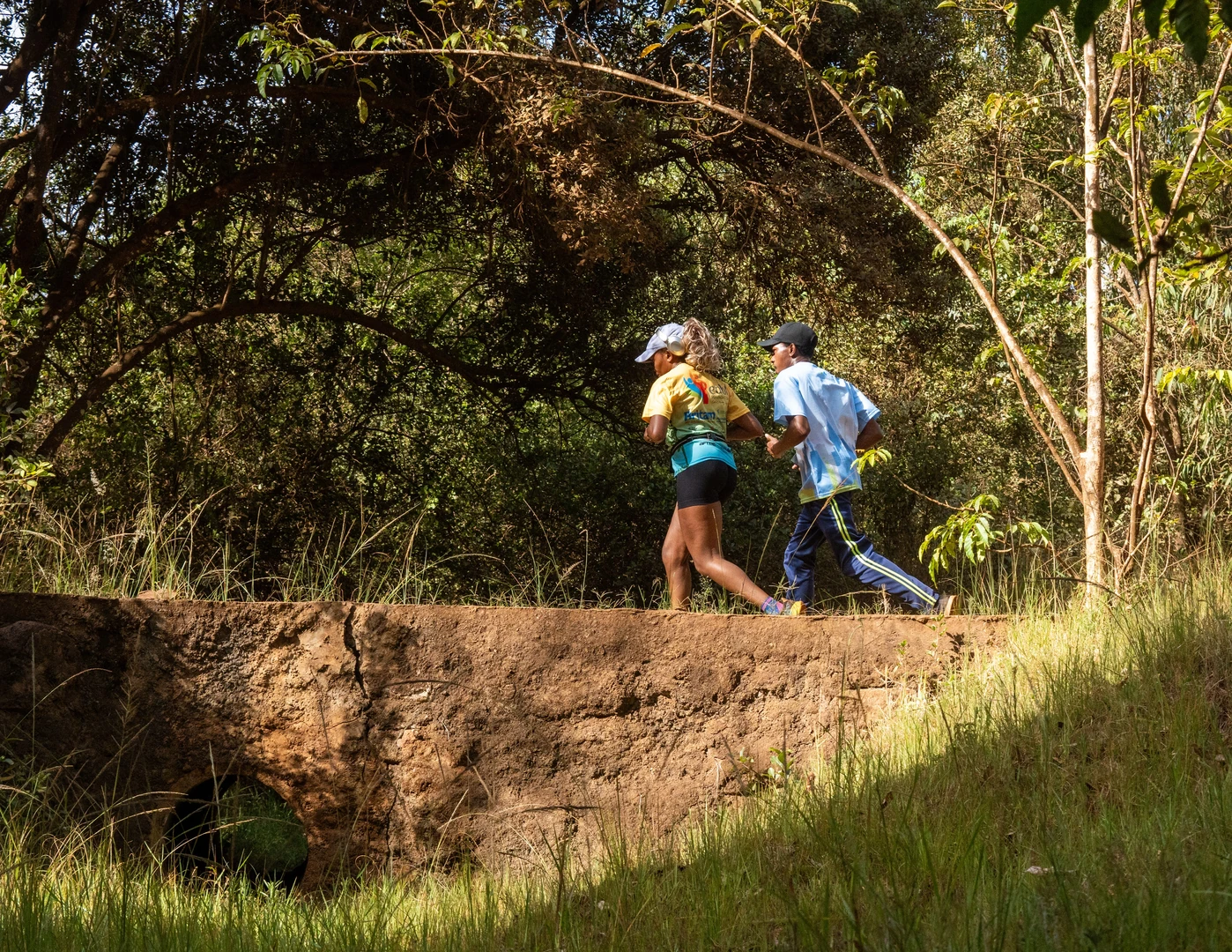 Two people running on a forest trail in Nairobi